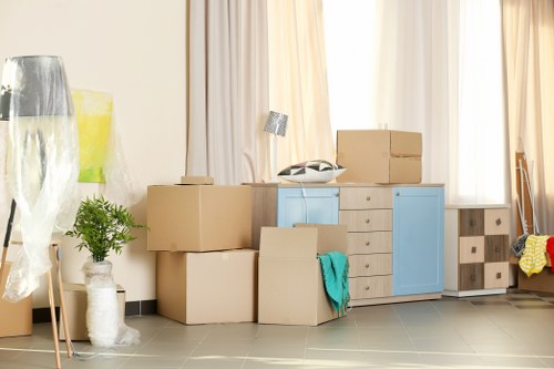 Boxes and furniture being loaded for a same day removal service