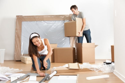 Removal team organising belongings during a Finchley house move