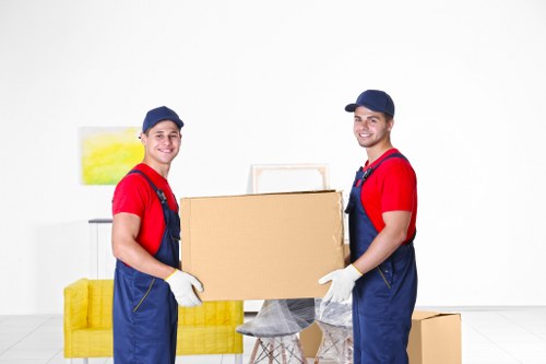 Moving boxes and furniture prepared for a Finchley home relocation