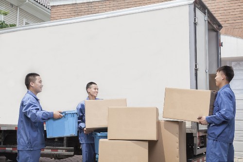 Loading furniture into a removal truck in Finchley