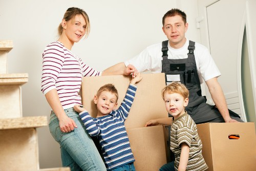 Local Finchley movers handling furniture with care in a residential street