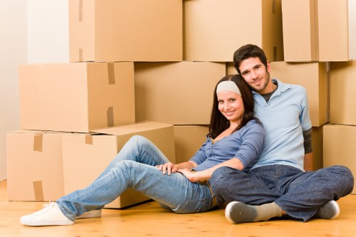 Careful unloading of moving items from a van in Finchley