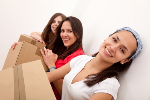 Packed office furniture and equipment ready for relocation in Finchley