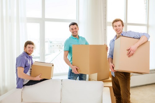 Relocation specialists loading office items for transport in Finchley