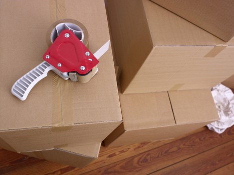 Expert packers protecting fragile items during a move in Finchley