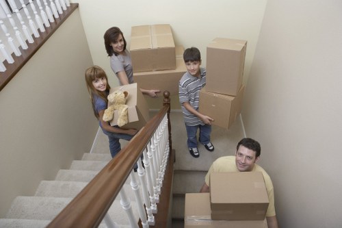 Staff following safe manual handling procedures during a removals job